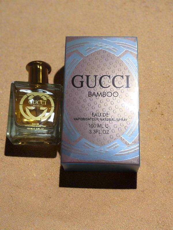 Gucci Bamboo perfume bottle and packaging on a textured surface